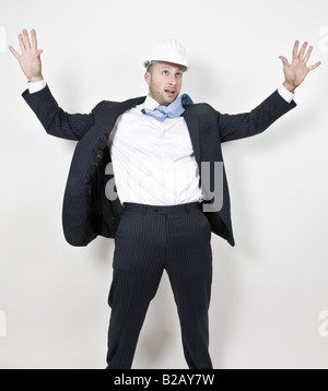 man standing with hands outstretched Stock Photo