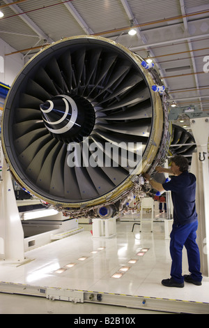Enginer works on a Rolls Royce jet engine in the production factory Derbyshire United Kingdom Stock Photo