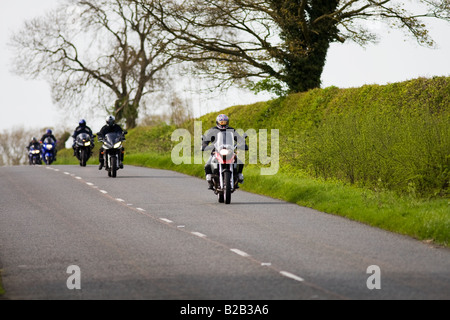 Motorcyclists on country road Stow On The Wold Oxfordshire United Kingdom Stock Photo