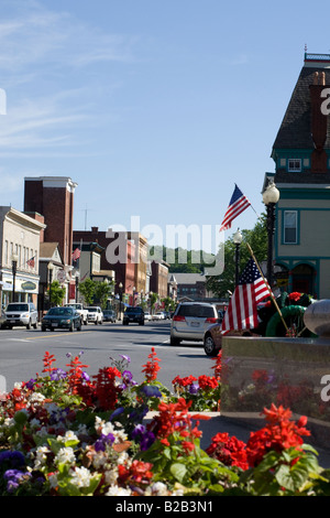 Adams Massachusetts has a picturesque main street where flags and flowers greet visitors Stock Photo