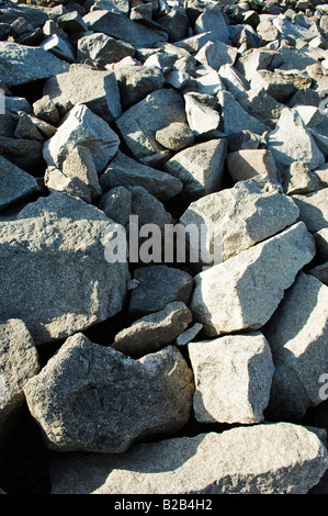 Hard granite stones making a dam wall Stock Photo