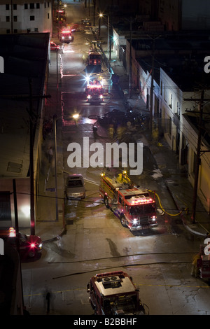 Fire engines arriving at downtown fire Stock Photo