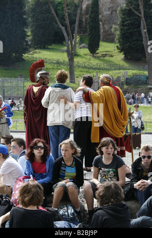 roman centurions and tourists by colosseum rome Stock Photo