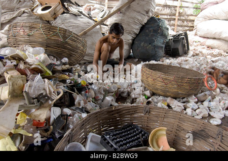 In the slums of Topsia everyone lives from waste, various types of plastic waste are sorted and sold on for recycling, apart fr Stock Photo