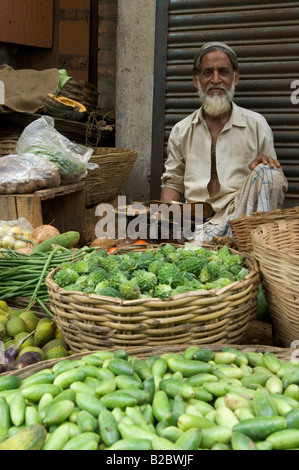 Produce vendor in Tikiapara suburb. Although there is a wide selection, there are people who are forced to eat only rice and di Stock Photo