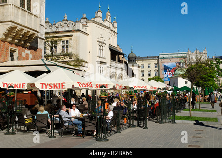 Street cafe in front of the Draper's Hall, Sukiennice, on Krakow Market Square, Rynek, UNESCO World Heritage Site, Poland, Euro Stock Photo