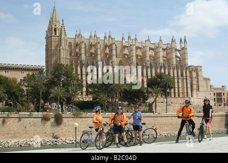 Sa Seu Cathedral and cyclists in Palma de Majorca, Majorca, the Balearic Islands, Spain, Europe Stock Photo