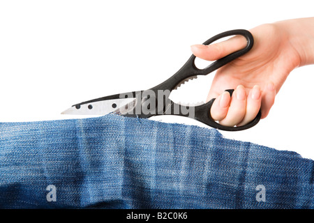 Woman hand cutting piece of fabric Isolated on white Stock Photo