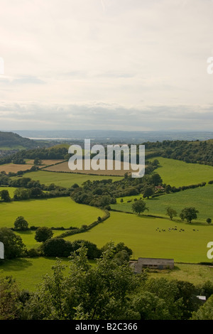 View from Uley Bury in Gloucestershire west across fields towards Severn Vale Wales and the Black Mountains Stock Photo