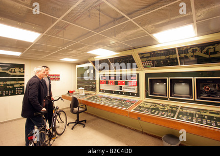 Employees observing the control room in the museum of the former Marienthal government bunker near Ahrweiler Stock Photo