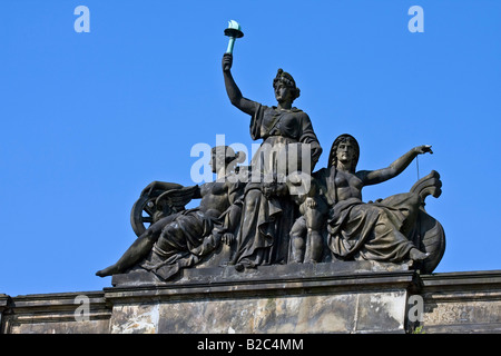 Sculptured group of figures on the roof of the historic building of a former post office, Oberpostdirektion, Hamburg Stock Photo