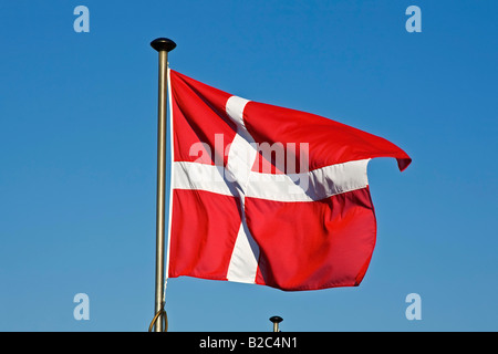 Danish Flag, Flag of Denmark, Dannebrog, fluttering in the wind on a flagpole Danish Flag, Flag of Denmark, Dannebrog, fluttering in the wind on a flagpole