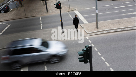 Pedestrian and car at traffic lights in the city, Hamburg, Germany Stock Photo