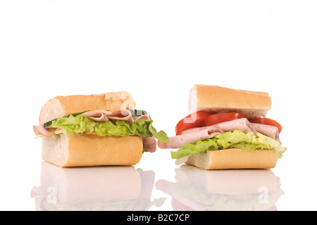 Ham sandwich and turkey sandwich with tomato, cucumber and lettuce Stock Photo