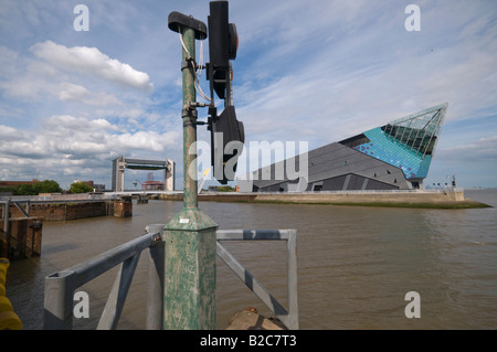 The Tidal Barrier and The Deep seen across the River Hull where it meets the River Humber in Hull, Yorkshire Stock Photo