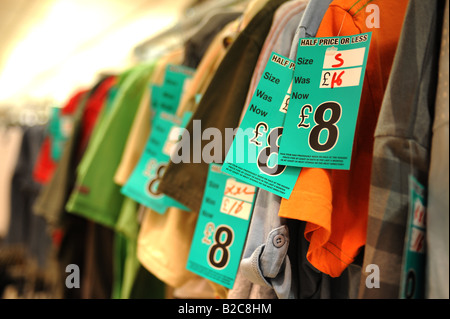 Clothes on sale in a retail clothes outlet UK Stock Photo