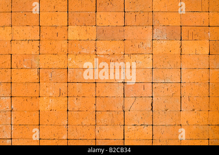 An abstract background created by closeup details blocks making up a yellowish brick wall Stock Photo