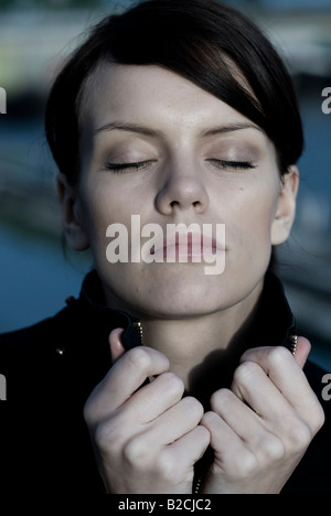 portrait of a young woman in evening light Stock Photo