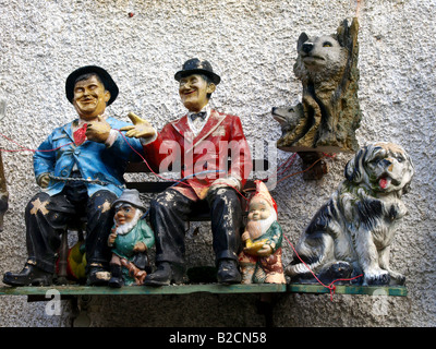 different figures for garden decorations, garden gnomes, Laurel and Hardy, dogs Stock Photo