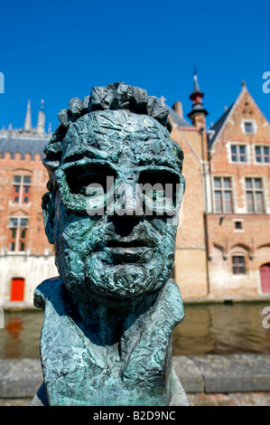 A statue of Frank Van Acker former mayor of Bruges and minister by the Vismarkt Stock Photo