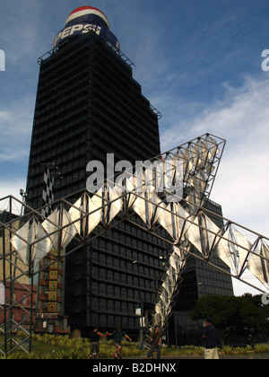Buildings and Abra Solar sculpture by Alejandro Otero, Plaza Venezuela, Caracas. Stock Photo
