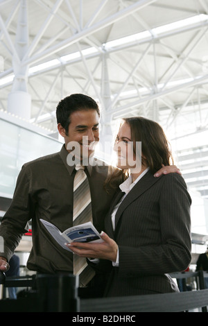 Happy businesspeople at the airport. Stock Photo