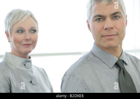 Mature couple standing in airport. Stock Photo