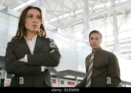 Businesspeople standing in airport. Stock Photo
