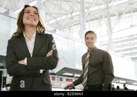 Happy businesspeople in airport. Stock Photo