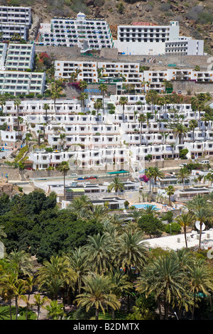 White painted concrete built apartments and hotels in holiday resort Puerto Rico Gran Canaria Spain Stock Photo