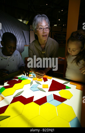 Students in art class with teacher showing a drawing Stock Photo - Alamy