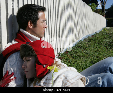 Young couple relaxing in yard. Stock Photo