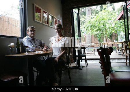 Young happy couple sitting in café. Stock Photo