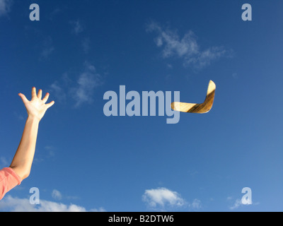 Detail of person throwing boomerang Stock Photo