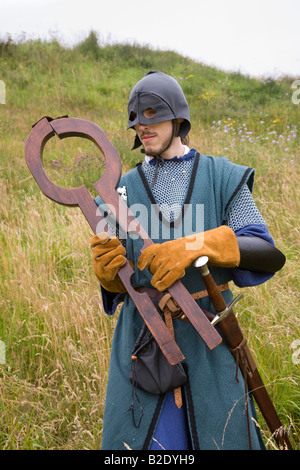 Shrew's Fiddle or Shrew's Fife, wooden neck restraint held by Masked Executioner (MR) at  Knights of Monymusk, re-enactment group, Scotland UK. Stock Photo