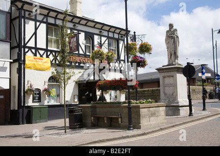 Ormskirk Lancashire England UK July The statue of Benjamin Disraeli in front of the Golden Lion public house Stock Photo