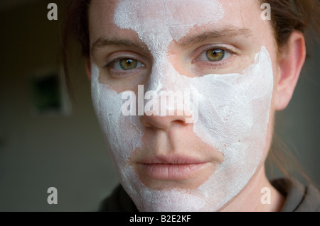 A woman wearing a white mud mask. Stock Photo