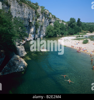 People bathing in La Beaume river and cliffs Gorges de la Beaume Ardèche departement France Stock Photo