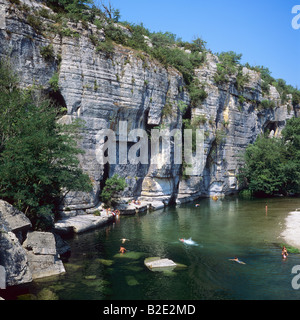 People bathing in La Beaume river and cliffs Gorges de la Beaume Ardèche departement France Stock Photo