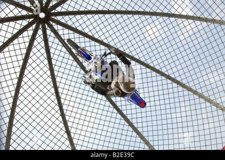 Extreme circus stunt riders show. Female motorcycle Globe of Death or Dome riders on lightweight motorcycles at Arbroath Seafront Spectacular, Angus, Stock Photo