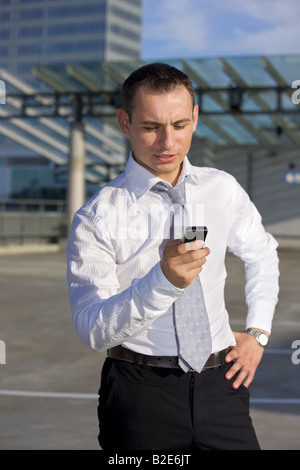 handsome businessman standing in a front of a building site Stock Photo