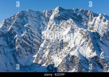 Snowcapped mountain under blue sky, Watzmann, Berchtesgaden Alps, Bavaria, Germany Stock Photo