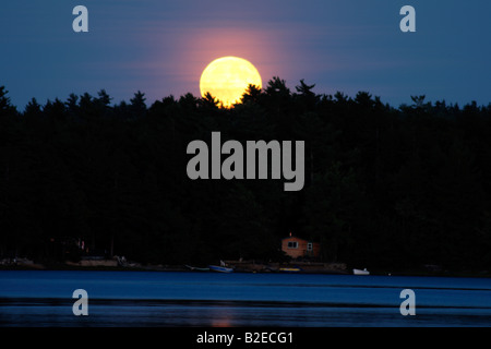 moon rise over a lake Stock Photo
