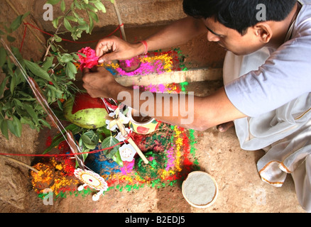 Priest constructs small shrine in honour of Durga for Dasara festival , India Stock Photo