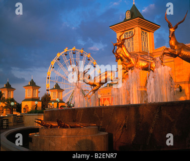 A fountain at Gold Reef City with a Ferris wheel in the background Stock Photo