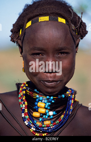 A young Dassanech girl wears a beautiful array of beaded necklaces.  Much the largest of the tribes in the Omo Valley. Stock Photo