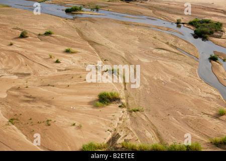 Aerial view of the Save River channel during the low-flow period and two saddle-billed stork flying Stock Photo