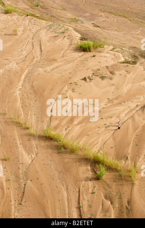 Aerial view of the Save River channel and two locals walking on a path crossing the dry riverbed Stock Photo