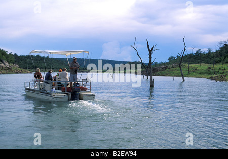 Anglers on a boat tiger fishing on lake Kariba Stock Photo