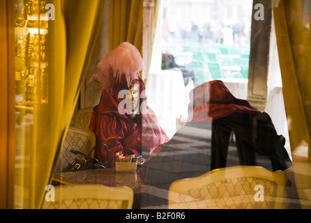 Venice Carnival costumed participants in Cafe Florian St Mark's Square Venice Stock Photo